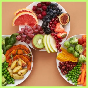 Fruits, vegetables and sea food sit on plates. 