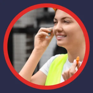 A woman puts in hearing protection. 