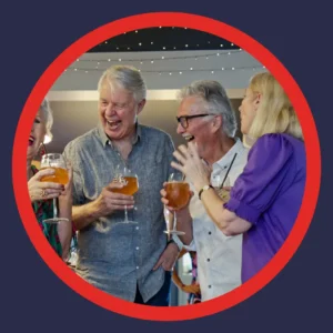 Older friends laugh together.