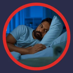 A man is wide awake in the middle of the night. 