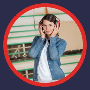 A woman puts on hearing protection headphones. 