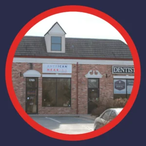 An American Hearing + Audiology hearing center has an open parking space in front.