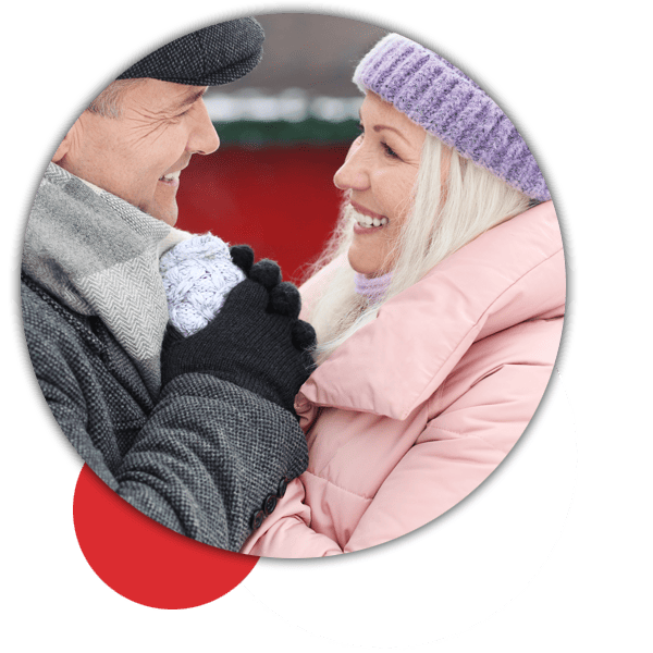 Happy couple enjoy a winter conversation with AHA hearing aids