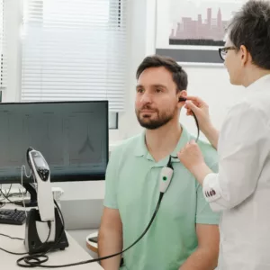 A man gets his hearing tested. 