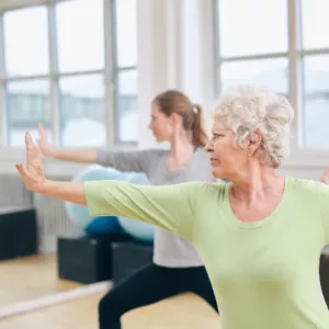 Older women doing yoga. 