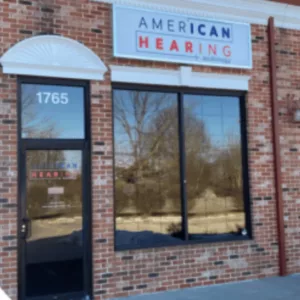 A brick storefront of an American Hearing + Audiology office in KC. 