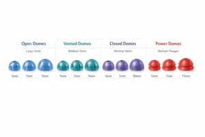 Brightly colored hearing aid domes sit next to each other. 