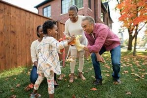 Young children play with their grandparents. 
