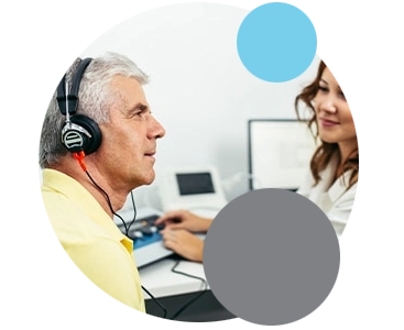 Man hearing test A middle aged man getting a hearing test done by hearing professional