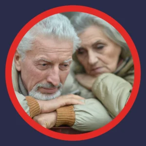 An older couple looks very sad.