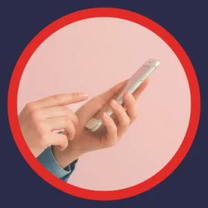 Hands hold a cell phone. 