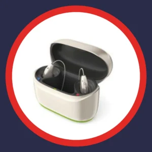 Phonak hearing aids sit in their charging case. 