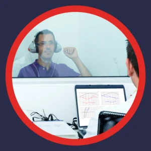 A man takes a hearing test. 