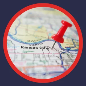 A push pin is next to Kansas City on a map.