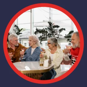 Older friends enjoy drinks at a restaurant. 