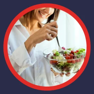 A woman eats a salad. 