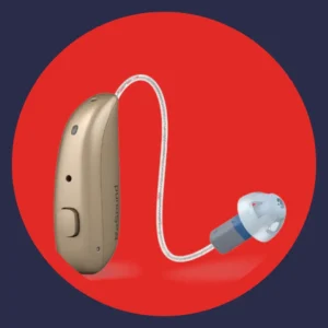 A gold Resound Nexia hearing aid stands on a red background. 