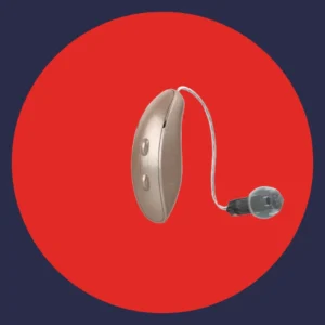 A gold Starkey Genesis hearing aids stands against a red background. 
