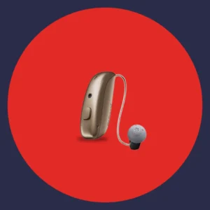 A gold Resound Vivia hearing aid stands on a red background. 