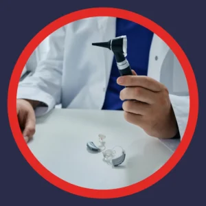 An audiologist holds an otoscope. 