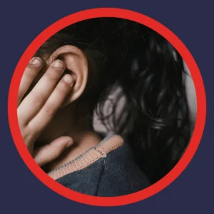 Fingers touch an ear. 