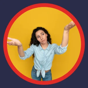 A woman holds her hands up in confusion.