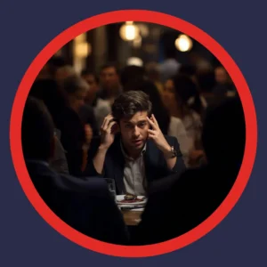 A man tries to hear while sitting at a crowded restaurant. 